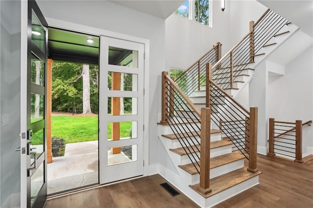 entryway with dark wood-type flooring