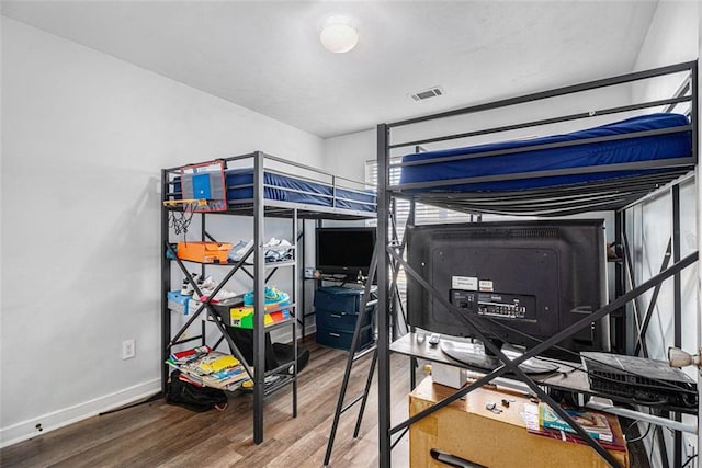 bedroom featuring hardwood / wood-style floors