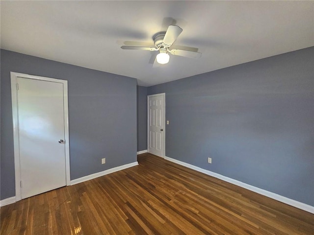 1150 Goldsmith Rd, Stone Mountain, GA 30083 - empty room with wood finished floors, baseboards, and a ceiling fan