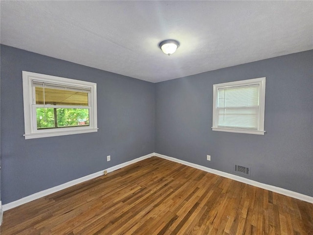 1150 Goldsmith Rd, Stone Mountain, GA 30083 - unfurnished room featuring wood finished floors and baseboards