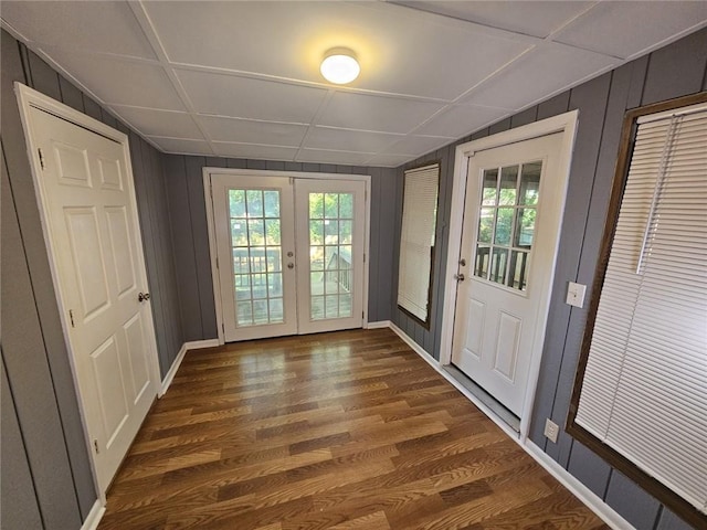 1150 Goldsmith Rd, Stone Mountain, GA 30083 - doorway featuring french doors, dark wood-style flooring, plenty of natural light, baseboards, and a decorative wall
