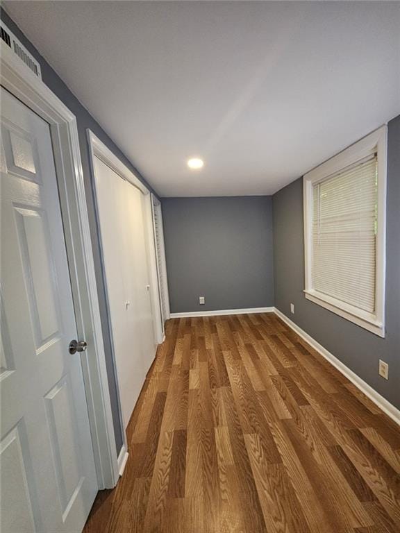 1150 Goldsmith Rd, Stone Mountain, GA 30083 - unfurnished bedroom with wood finished floors, baseboards, and recessed lighting