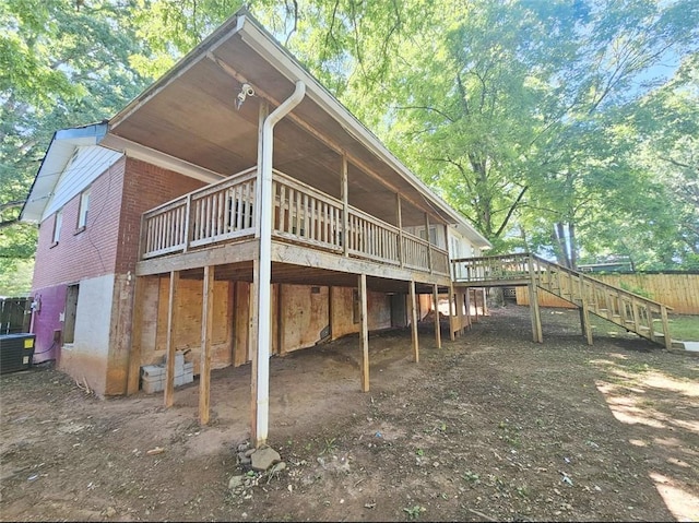 1150 Goldsmith Rd, Stone Mountain, GA 30083 - back of house with stairs, a wooden deck, and central AC