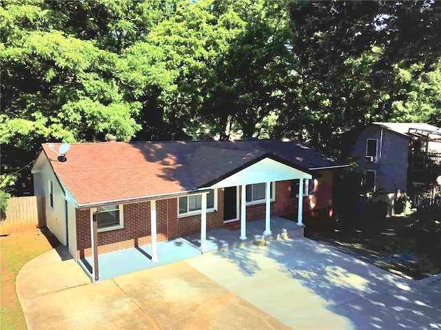 1150 Goldsmith Rd, Stone Mountain, GA 30083 - ranch-style house with brick siding, driveway, and roof with shingles