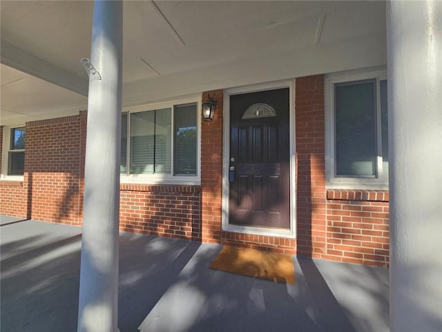1150 Goldsmith Rd, Stone Mountain, GA 30083 - view of exterior entry featuring brick siding and a porch