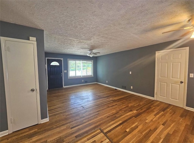 1150 Goldsmith Rd, Stone Mountain, GA 30083 - spare room featuring ceiling fan, wood finished floors, a textured ceiling, and baseboards