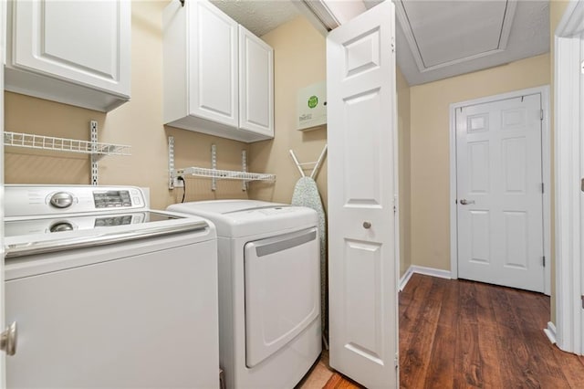 washroom with independent washer and dryer, wood finished floors, cabinet space, and baseboards