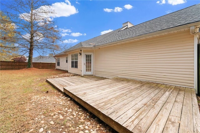 deck featuring fence and a lawn