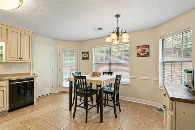 dining space with baseboards, visible vents, an inviting chandelier, a textured ceiling, and light tile patterned flooring