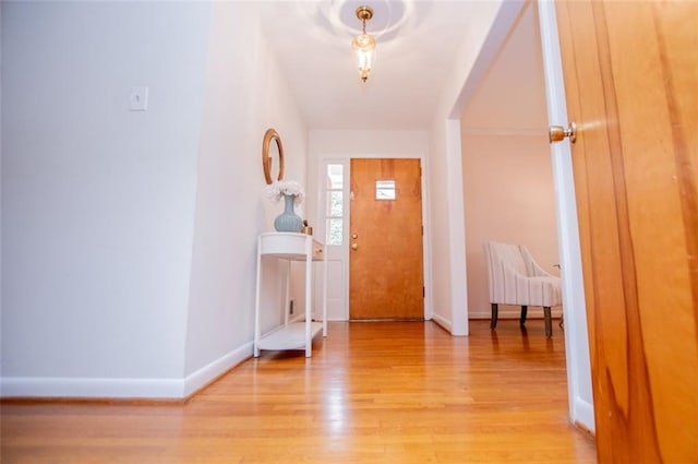 entryway featuring light wood-type flooring and baseboards