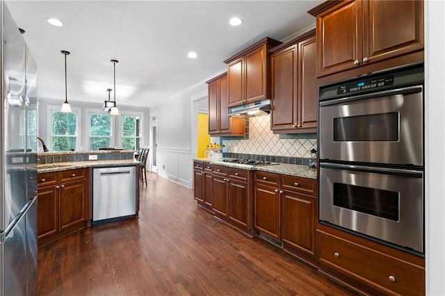 32 Pullman Trl, Acworth, GA 30101 - kitchen with appliances with stainless steel finishes, backsplash, dark wood-style floors, light stone counters, and recessed lighting