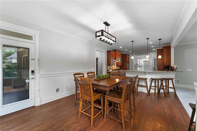 32 Pullman Trl, Acworth, GA 30101 - dining room with dark wood-type flooring, ornamental molding, wainscoting, and recessed lighting