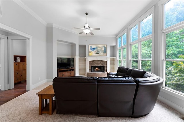 32 Pullman Trl, Acworth, GA 30101 - living area featuring carpet, ceiling fan, crown molding, a brick fireplace, and built in features