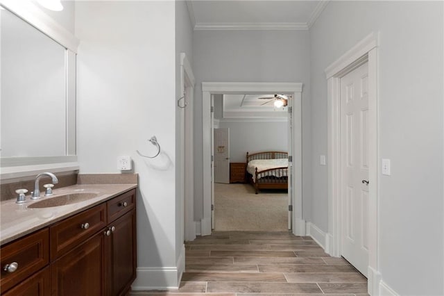 32 Pullman Trl, Acworth, GA 30101 - ensuite bathroom with ornamental molding, vanity, wood finished floors, and ceiling fan