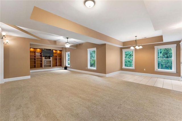 32 Pullman Trl, Acworth, GA 30101 - unfurnished living room with carpet, a ceiling fan, a chandelier, and tile patterned flooring