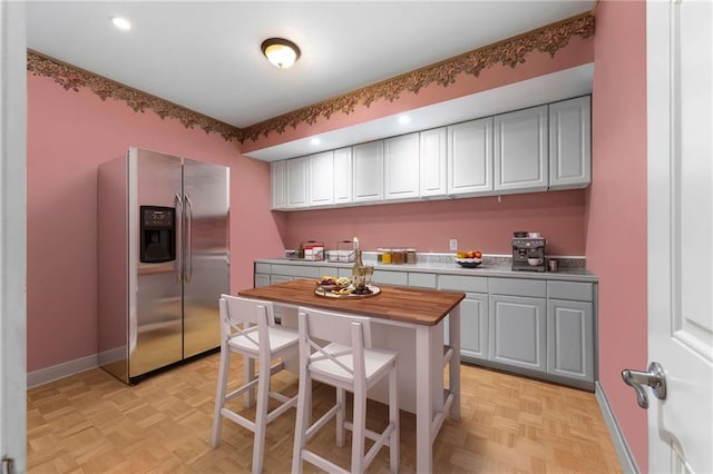 32 Pullman Trl, Acworth, GA 30101 - kitchen featuring stainless steel fridge with ice dispenser, butcher block counters, recessed lighting, and white cabinets