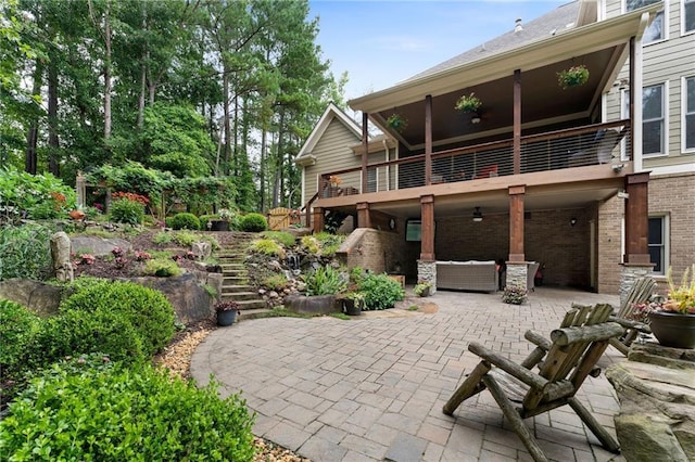 32 Pullman Trl, Acworth, GA 30101 - back of house with a balcony, stairway, a patio area, brick siding, and an outdoor living space