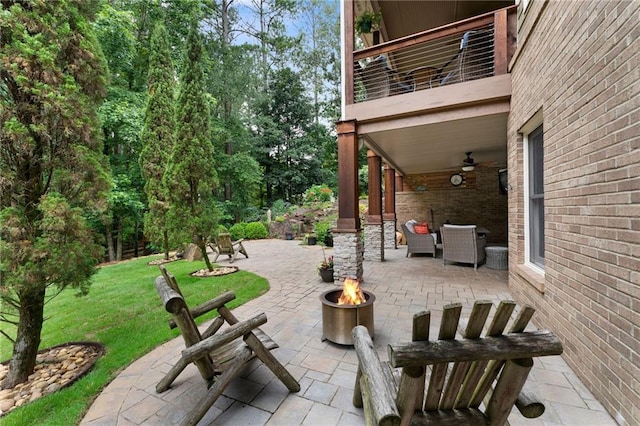 32 Pullman Trl, Acworth, GA 30101 - patio / terrace with a fire pit, a patio, a ceiling fan, a lawn, and outdoor dining space