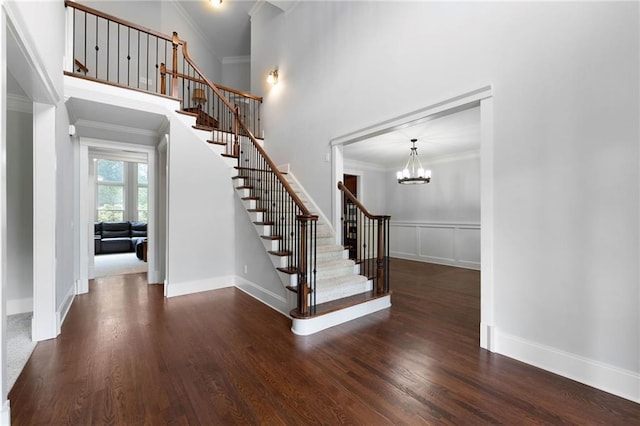 32 Pullman Trl, Acworth, GA 30101 - stairs with crown molding, wood finished floors, a chandelier, and a high ceiling
