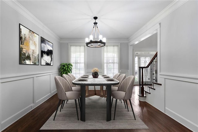 32 Pullman Trl, Acworth, GA 30101 - dining space featuring a decorative wall, a chandelier, healthy amount of natural light, dark wood-style floors, and ornamental molding