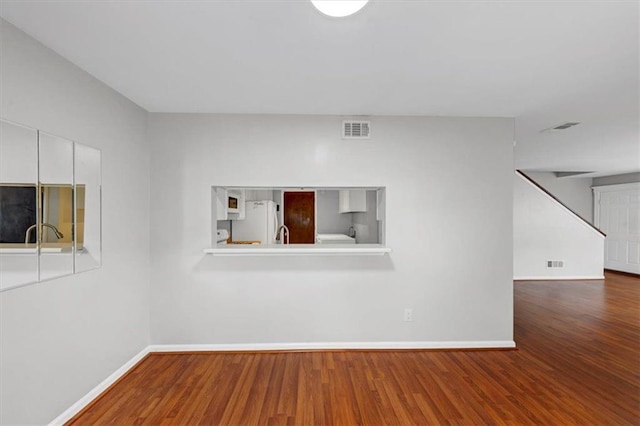 empty room with wood-type flooring