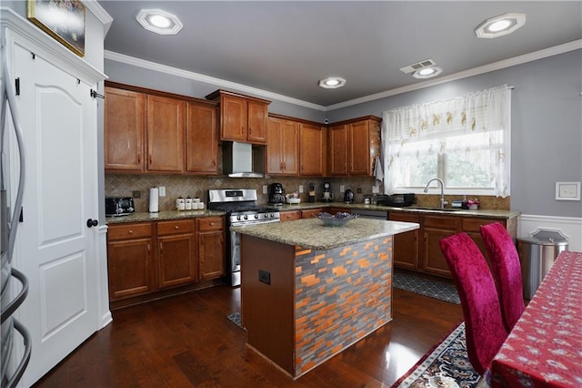 kitchen with sink, a center island, stainless steel range with gas cooktop, dark wood-type flooring, and ventilation hood