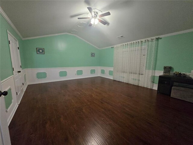 additional living space with dark hardwood / wood-style floors, ceiling fan, and vaulted ceiling