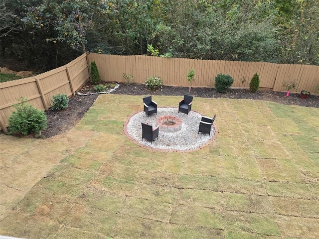 view of yard with a patio and a fire pit