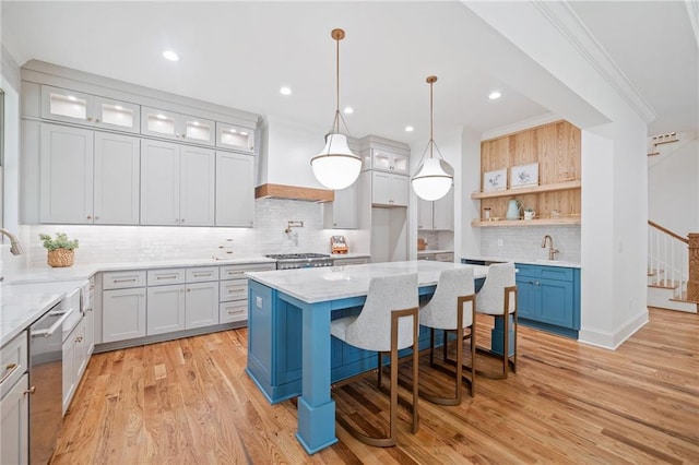 kitchen featuring open shelves, stainless steel dishwasher, tasteful backsplash, light wood-type flooring, and custom exhaust hood