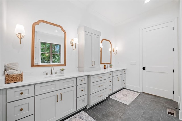 bathroom featuring double vanity, recessed lighting, and crown molding