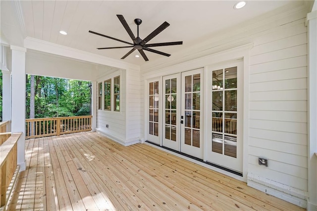 wooden terrace featuring a ceiling fan and french doors