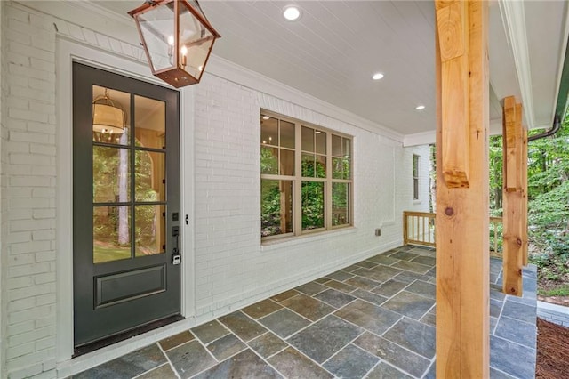 entrance to property featuring a porch