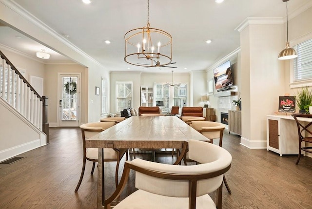 dining space featuring a chandelier, dark wood-style flooring, plenty of natural light, baseboards, and recessed lighting