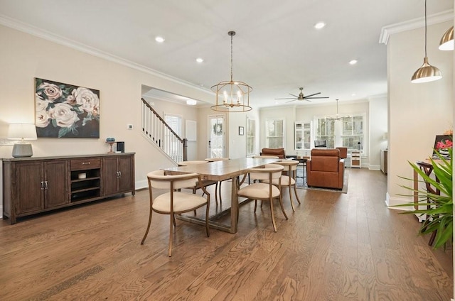 dining room featuring ornamental molding, wood finished floors, baseboards, stairs, and recessed lighting