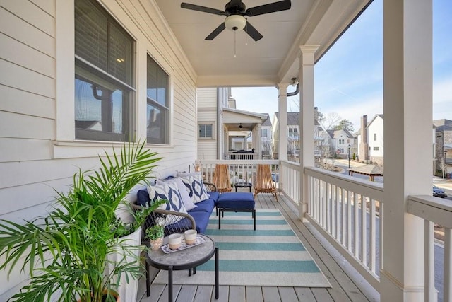 balcony with a ceiling fan and a residential view