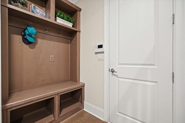 mudroom with baseboards and wood finished floors