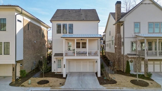 view of front of house featuring a garage, concrete driveway, a shingled roof, and a balcony