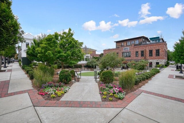 view of community with a gate and fence