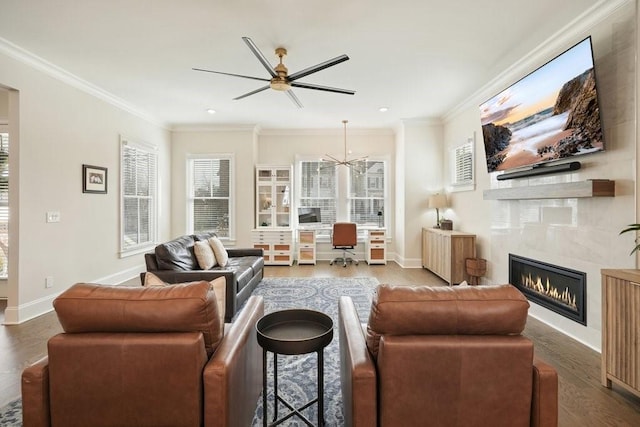 living room with crown molding, a fireplace, baseboards, and dark wood-type flooring