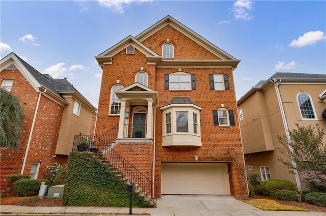 view of front of property featuring a garage, stairs, concrete driveway, and brick siding