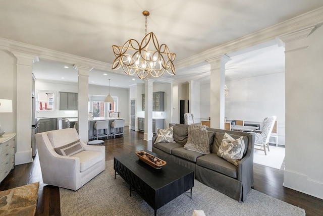 living room featuring recessed lighting, baseboards, ornamental molding, dark wood-style floors, and decorative columns