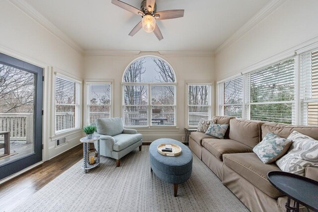 sunroom / solarium featuring visible vents and ceiling fan