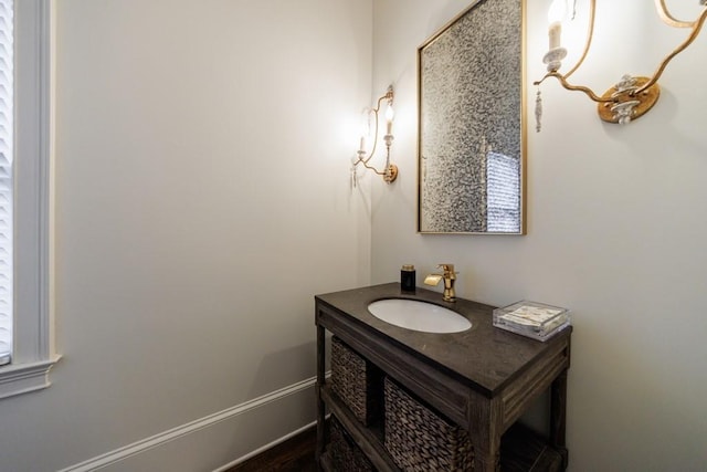 bathroom with vanity and baseboards