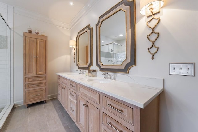 full bathroom with double vanity, ornamental molding, a stall shower, and a sink