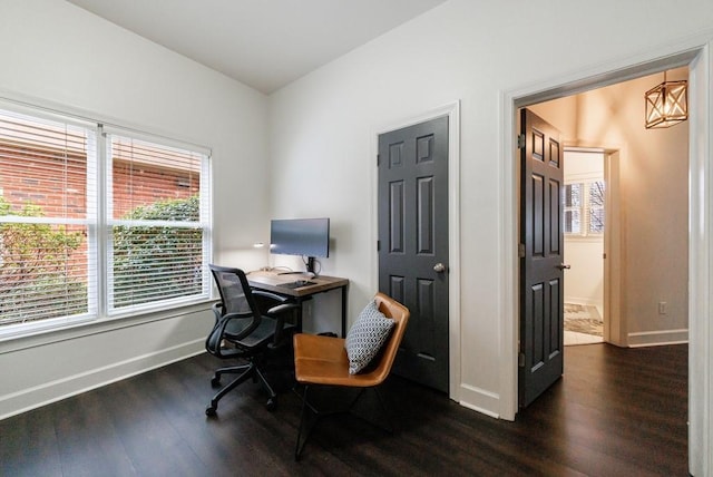 home office with baseboards, dark wood-type flooring, and a healthy amount of sunlight