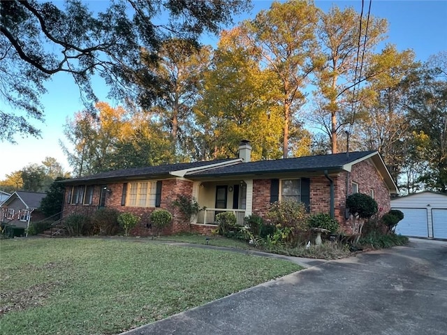 1017 Clifton Dr, Macon, GA 31204 - single story home featuring brick siding, an outdoor structure, a front lawn, and a garage