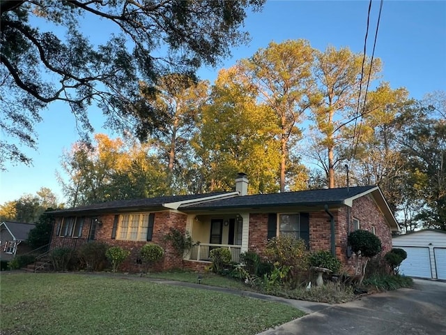 1017 Clifton Dr, Macon, GA 31204 - single story home with brick siding, an outbuilding, a front lawn, and covered porch