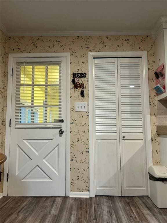1017 Clifton Dr, Macon, GA 31204 - entryway featuring ornamental molding, wallpapered walls, and dark wood-style floors