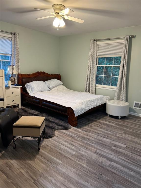 1017 Clifton Dr, Macon, GA 31204 - bedroom with wood finished floors and a ceiling fan