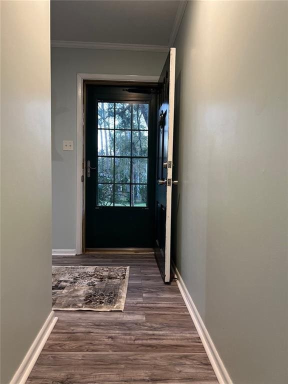 1017 Clifton Dr, Macon, GA 31204 - doorway featuring ornamental molding, dark wood-style flooring, and baseboards